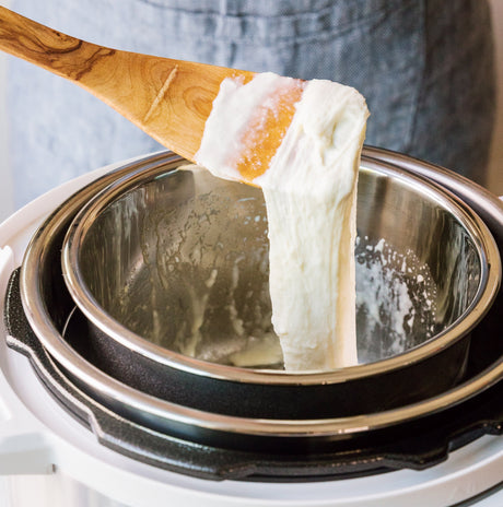 mozzarella being stretched in an instant pot water bath