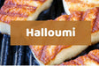 Grilled halloumi cheese slices with golden-brown charred marks on a dark grill, overlaid with a semi-transparent brown banner containing the white text 'Halloumi'.